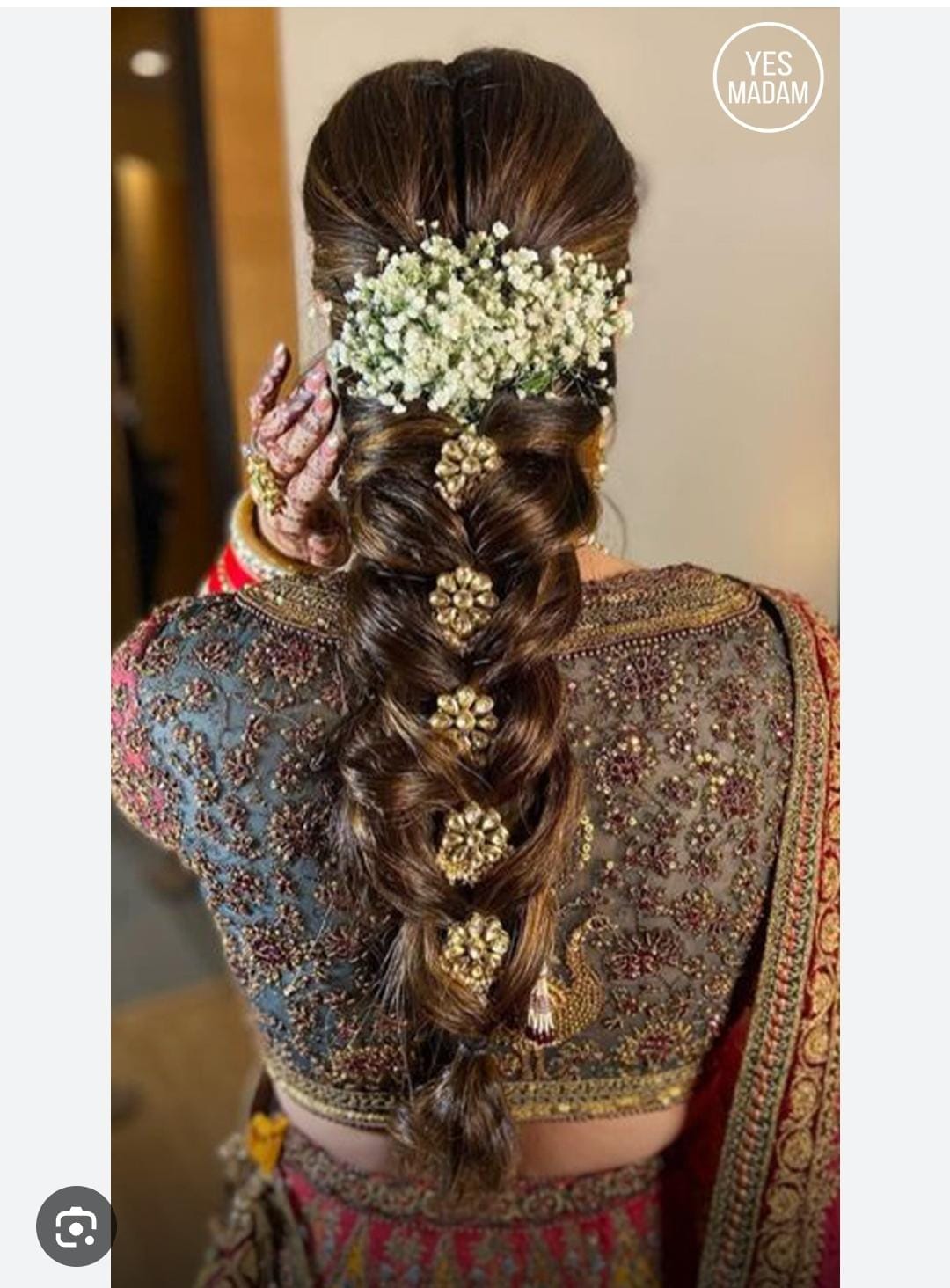 Intricate bridal hairstyle with flowers and jewelry